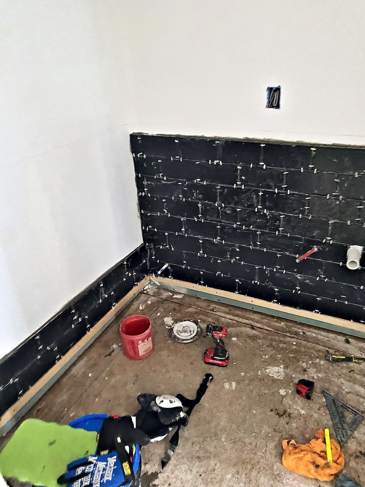 Subway tile going up during the Forks Township bathroom build