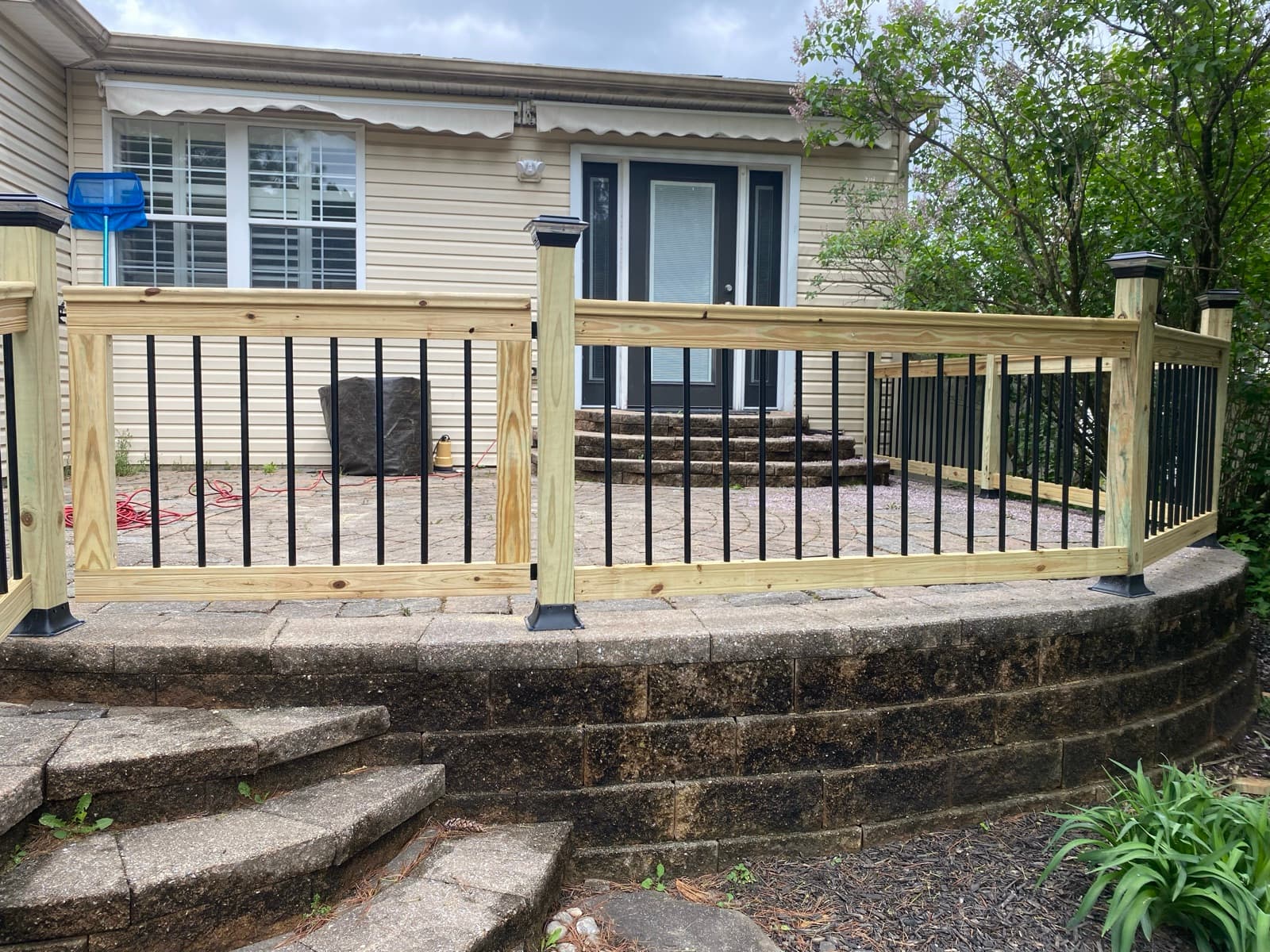 Paver patio and railing built at a Northampton home