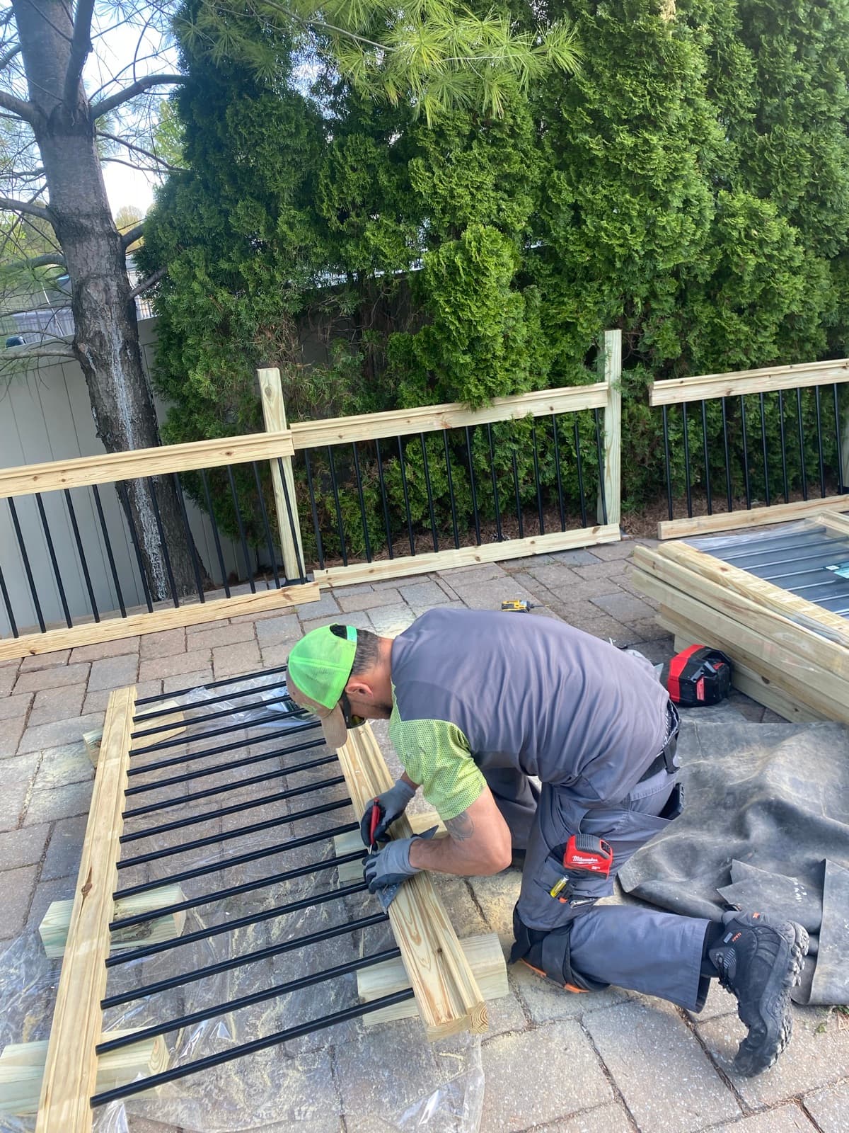 James Duckworth assembling a custom railing section on the Northampton patio